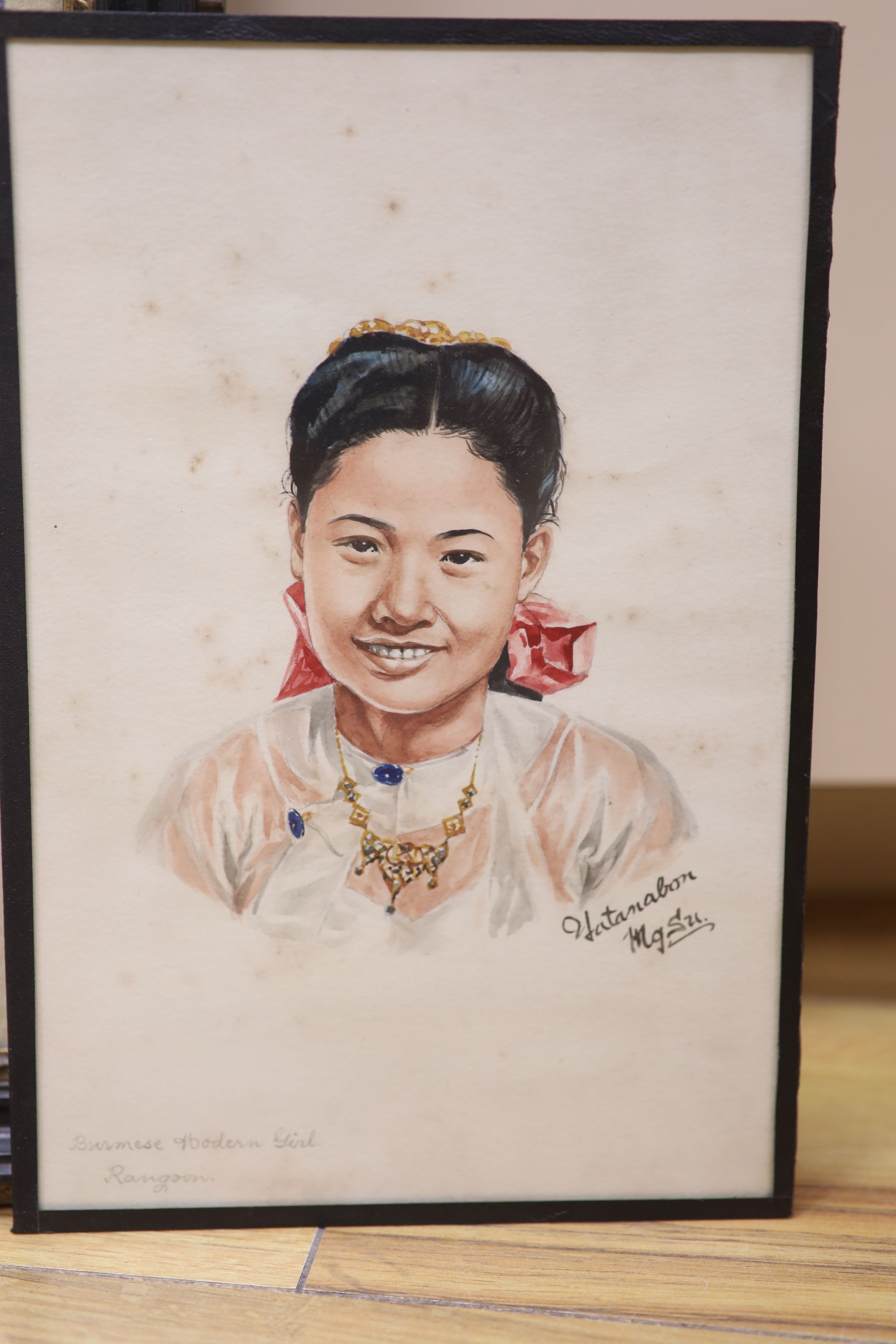 Mgsu Yatanabon, three watercolours, Studies of a Burmese monk, a Kachin girl and another girl, signed, 24 x 16cm and a larger watercolour, signed Naik, 41 x 32cm